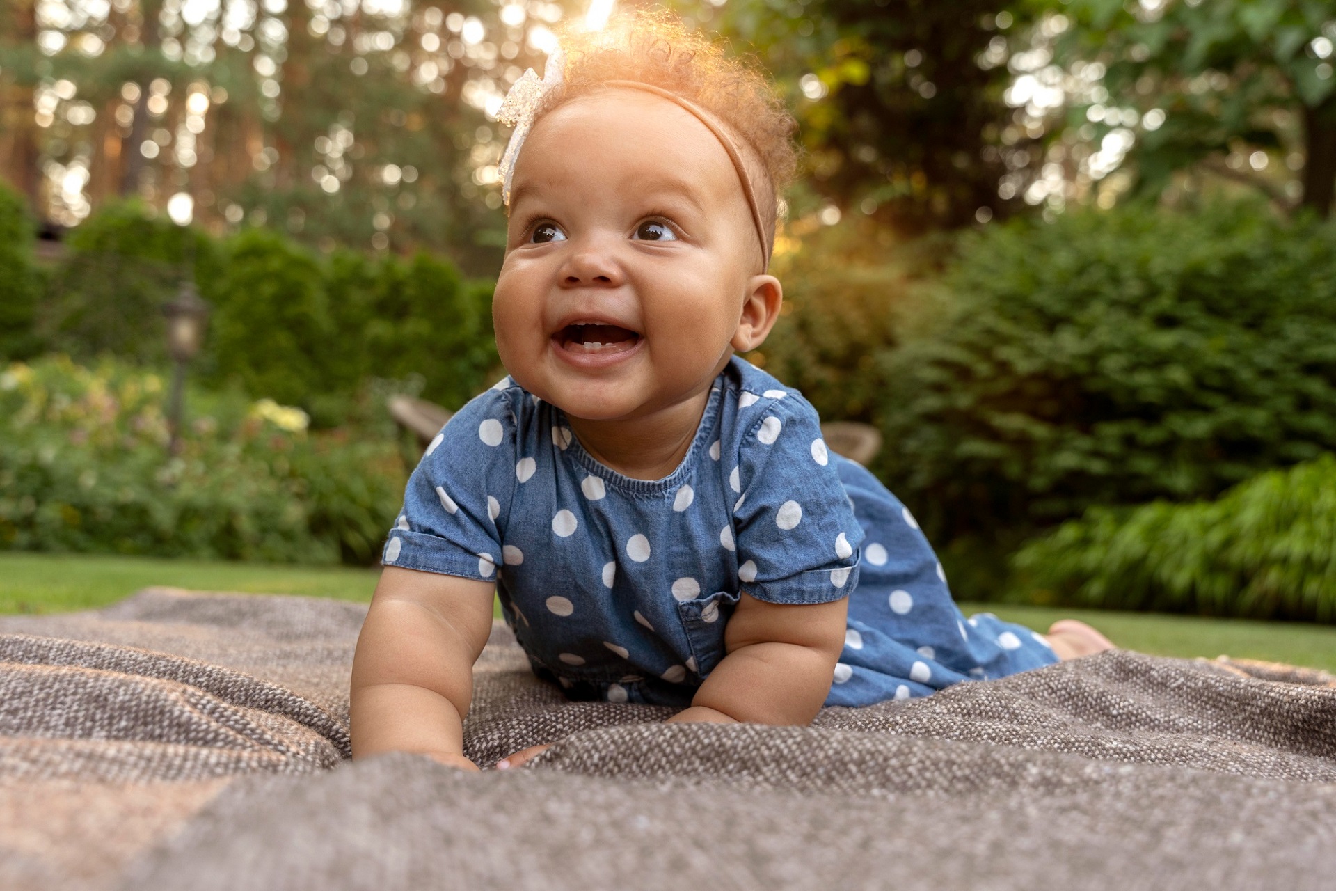 full-shot-smiley-baby-nature